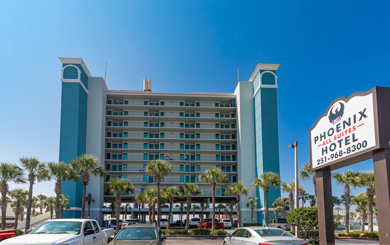 Sugar-white beach and turquoise Gulf water in front of Phoenix All Suites, Gulf Shores, Alabama